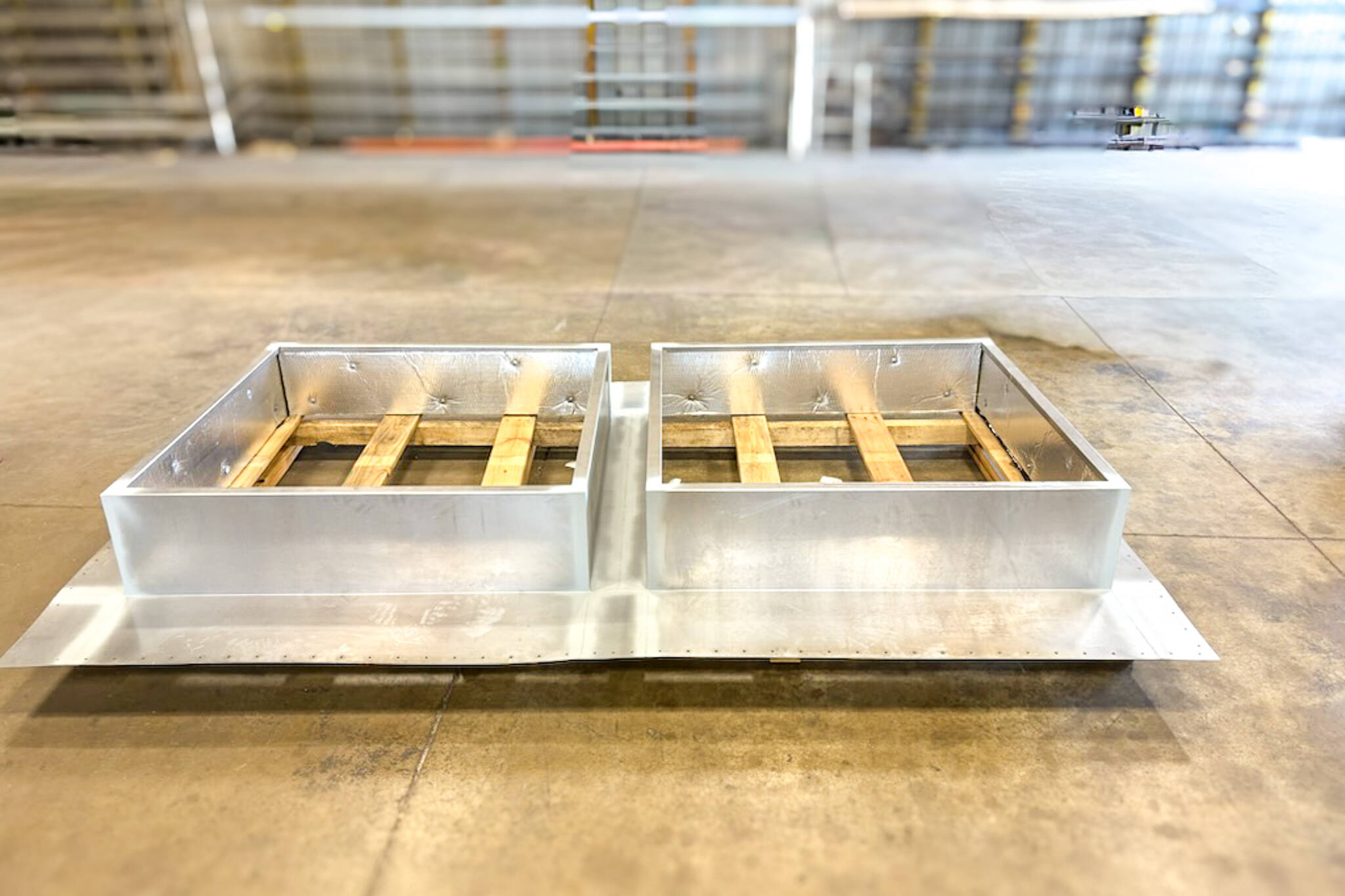 metal roof curb laid on the shop floor