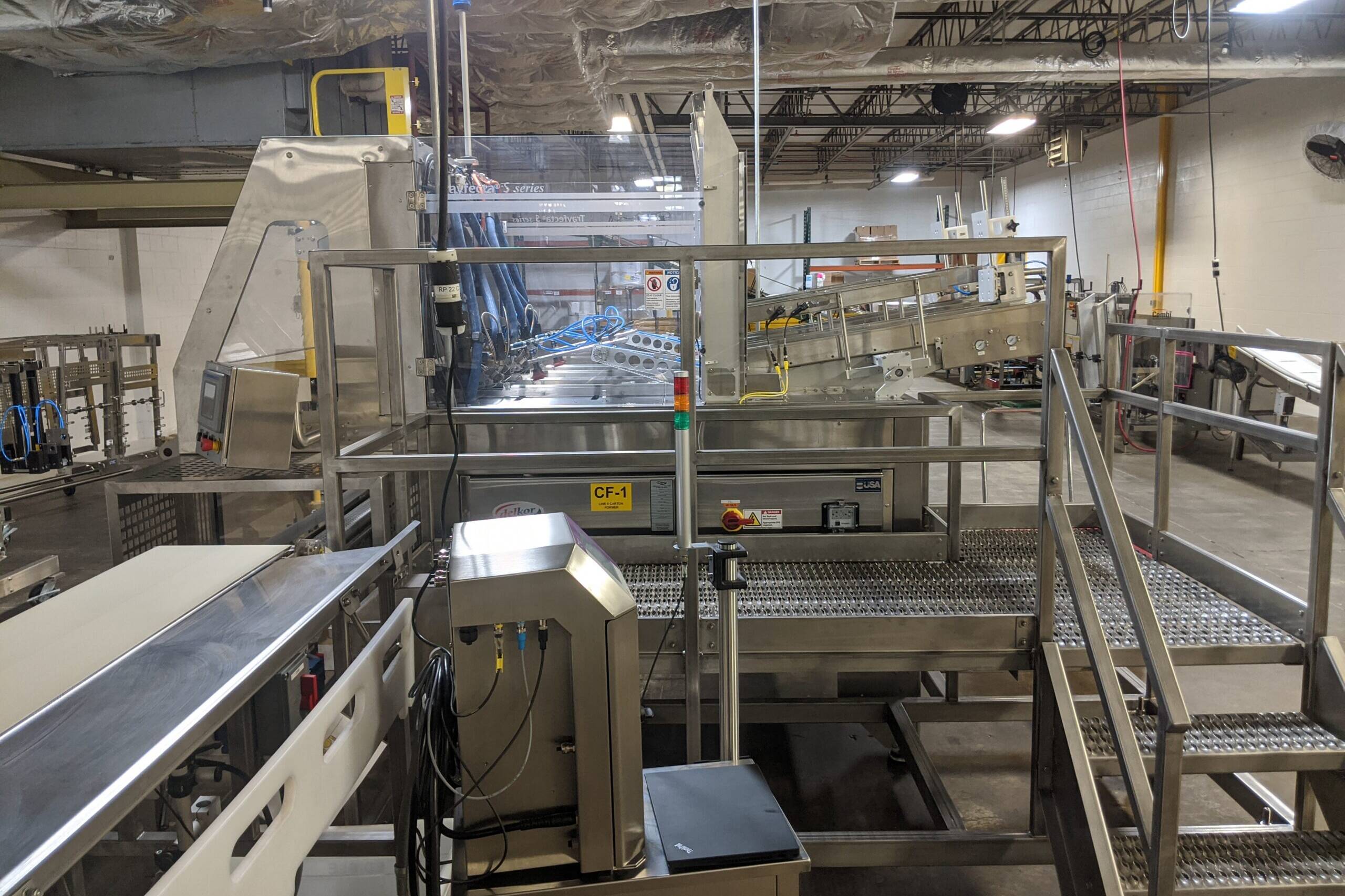 metal staircase and platform in an indoor manufacturing facility
